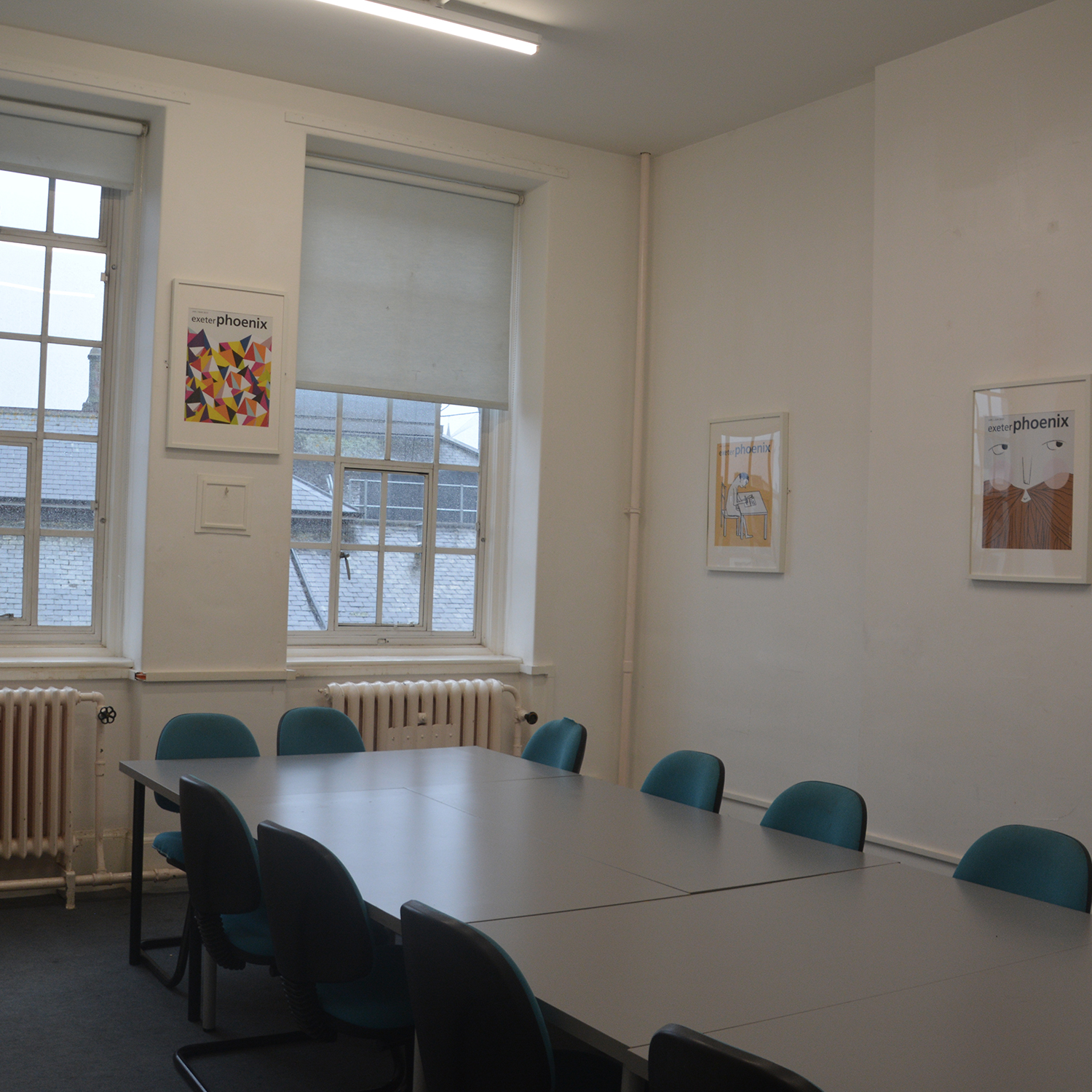 A board table sits in a middle of the room.