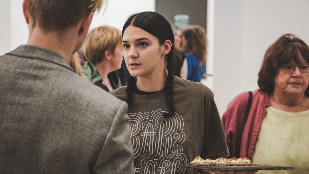 Canapes are served at the opening of a gallery