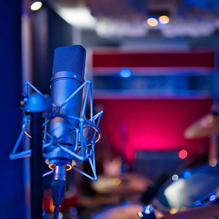 recording mic in focus with out of focus background of recording studio