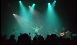 live image with a man with his hands in the air