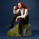 Alasdair Beckett-King sat on a mossy rock