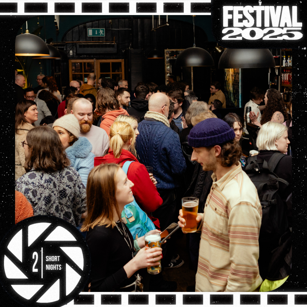 A crowded bar with people enjoying themselves.