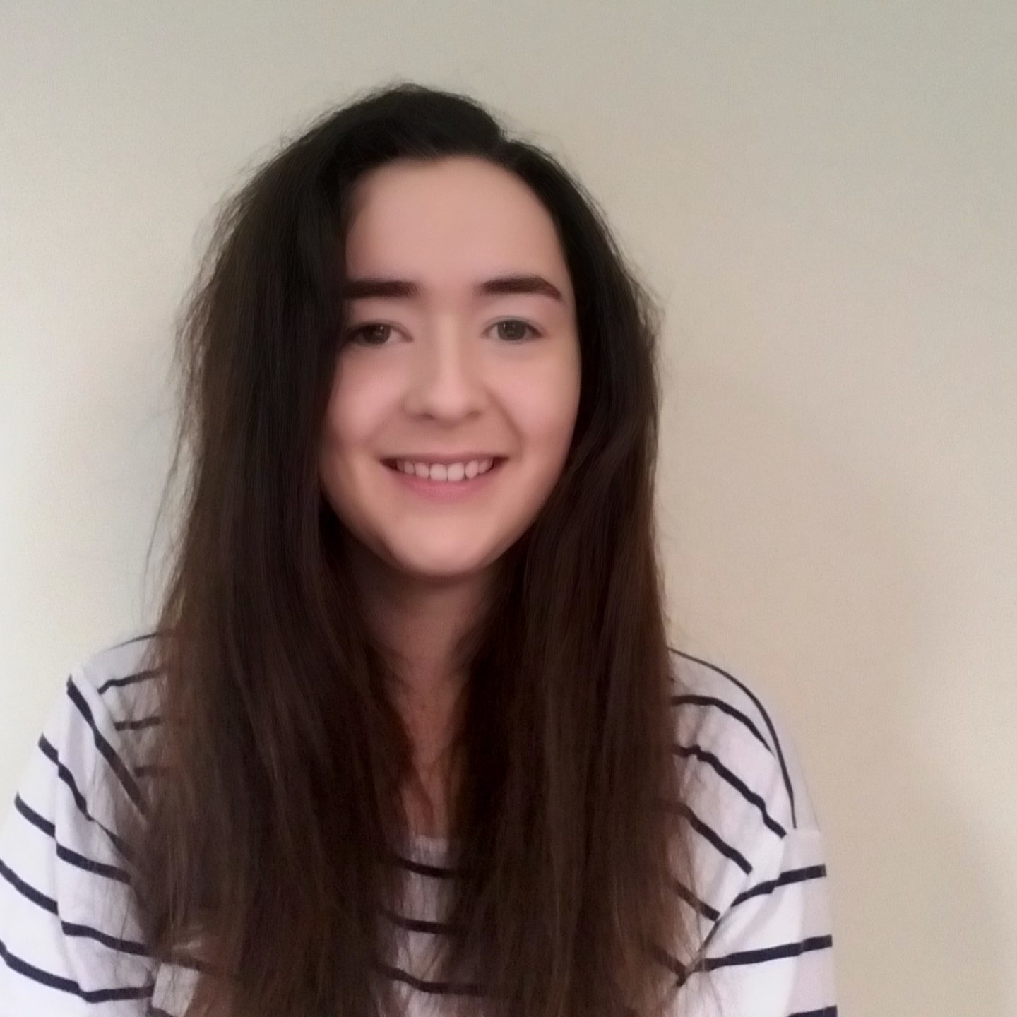 Woman staring into camera.